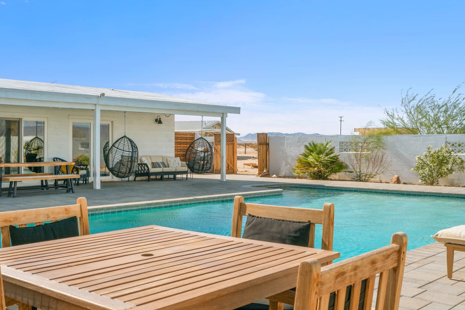 Wonder Valley Ranch — desert pool and patio with mountain views