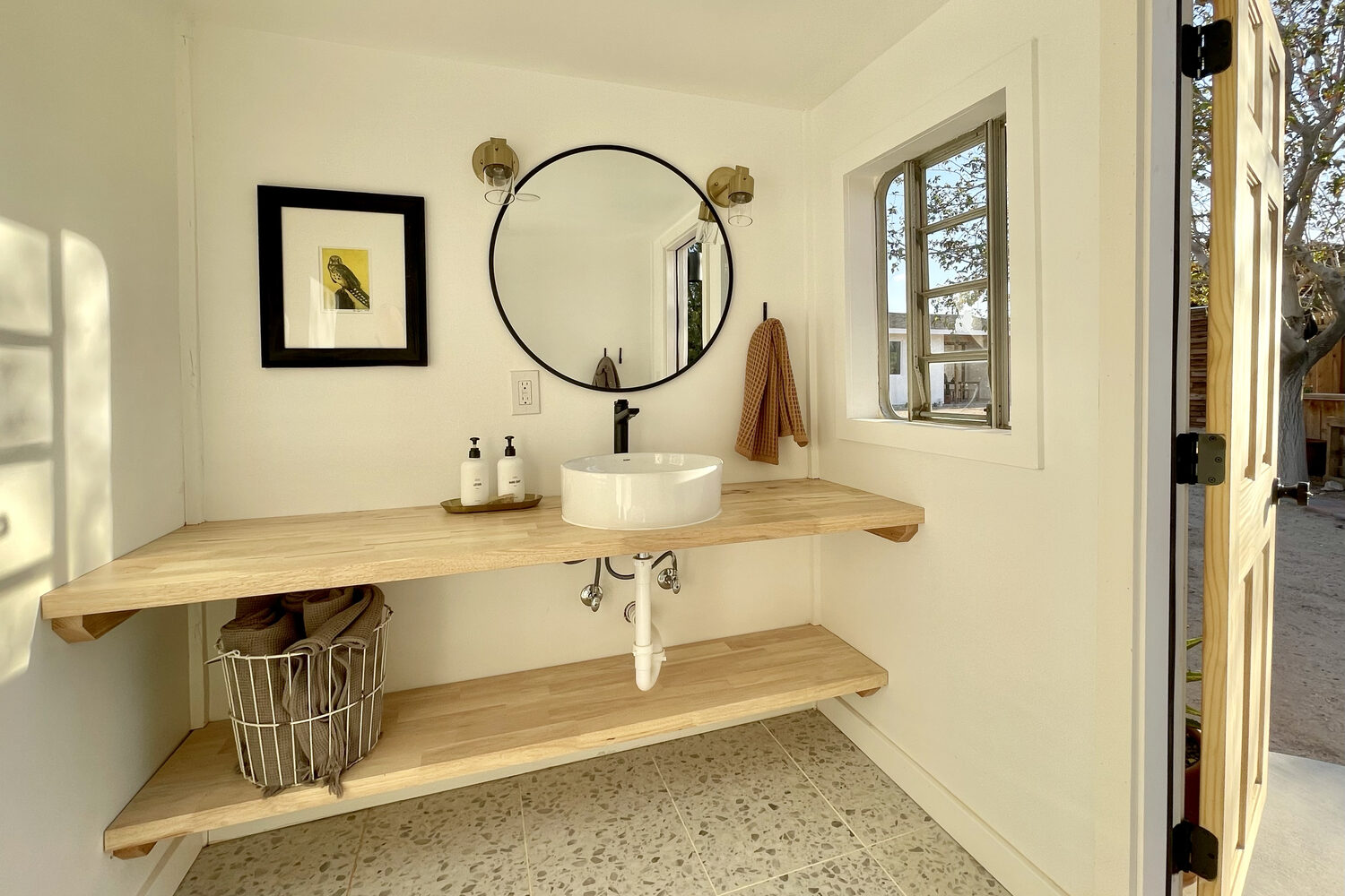 Inside the shed, now a finished bathhouse with an outdoor shower
